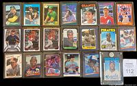 Assorted rookie cards laid out in two rows showing A’s, Giants, Pirates, Royals, Cardinals and more.