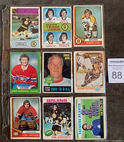 First binder sleeve with nine cards: Bobby Orr Bruins, Phil Esposito Team Leaders, Bobby Orr portrait, Larry Robinson Canadiens, Gordie Howe All Star, Super Action card, Ken Dryden Canadians, Phil Esposito Bruins, Jacques Plante All Star.