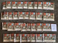 34 unopened 1992 CFL All World wax packs laid out in rows