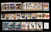 Photo of 45 Upper Deck MVP hockey trading cards laid out in rows, showing front designs, including patch memorabilia cards and player action shots.