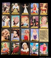 Close-up display of individual Marilyn Monroe cards from 1995 with gold signature borders and colorful images.
