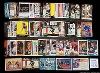 Collection of multiple Wayne Gretzky hockey cards laid out showing different card backs and designs including the number 99 and a large '2000' card