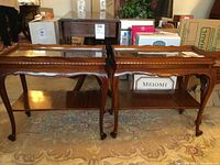 Pair of mahogany side tables with glass top insets, shown side by side, highlighting overall condition and style