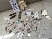 Overview of entire jewelry assortment laid out on surface