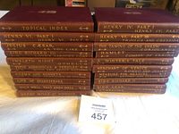 Photo of the 20-volume set of antique Shakespeare works including topical index volumes, showing brown covers with gilt titles.