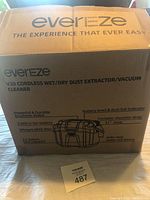 Box of Evereze V20 cordless wet/dry dust extractor/vacuum cleaner showing front with brand and model info, features list.