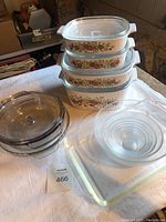 Full set photo showing four nested Corningware Spice of Life casserole dishes with glass lids, Anchor Hocking pie plate and casserole dish, Duralex nesting bowls, and Fire King baking dish.