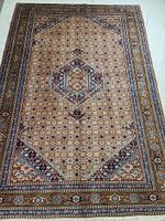 Full view of rectangular rug showing central medallion and border