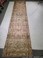 Full front view of the runner laid out on white sheet showing overall design and condition