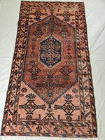 Full view of rug laid flat showing overall pattern and colors