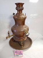 Full view of the antique copper brass samovar with tray, showing the main body, spigots, footed base, and tray.