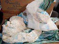 Wedding dress and matching head veil displayed in vintage Priscilla of Boston branded box with tissue paper