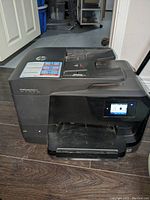 Left angled view showing touchscreen and automatic document feeder