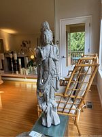 Full front view of the statue in living room setting