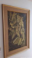 Oblique view of entire framed print hanging on wall