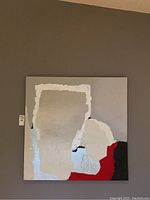 Front view of the original abstract art on canvas showing a square painting with gray, white, black, and red textured shapes