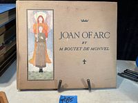 Front cover of Joan of Arc book by M. Boutet de Monvel with colored illustration and title.