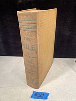 Photo of beige hardcover book spine with title 'The Nile' and author Emil Ludwig in blue text.