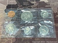 Photo of front side of 1971 Canadian proof-like coin set in plastic packaging showing all seven coins.