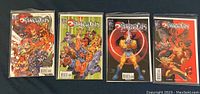 Four Thundercats comic books in a row showing colorful covers with characters from the series.