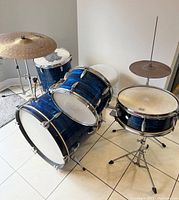 Image showing the assembled blue finish drum kit including bass drum, floor tom, high tom, snare, Paiste 200 ride cymbal and hi-hat cymbal with hardware.