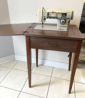 Full view of White Viking model 1266 sewing machine mounted on wooden sewing cabinet.