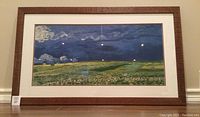 Framed poster print of Van Gogh's Wheatfield Under Thunderclouds showing entire frame and artwork, clear view of image and condition of frame.