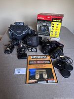 Overview of Canon EOS Rebel kit box, DSLR body, lens, video and digital cameras, camera bags, accessories