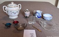 Top and front view of vintage kitchen and dining items laid out on a table showing the set composition.