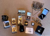 Overall view of all jewelry pieces and mesh purse on fabric surface