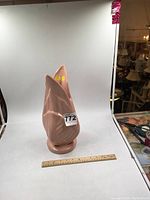 Full front view of the pink San Miguel vase next to a measuring ruler showing height approximately 15 inches.