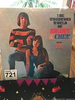 Front cover of The Wondrous World of Sonny & Cher vinyl album showing Sonny standing and Cher sitting, album title text, and plastic cover.