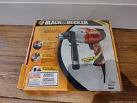 Original product box showing Black & Decker 1/2 inch VSR Drill/Driver model DR501 with features listed on box.