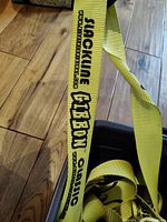 Close-up of yellow slackline webbing with Gibbon branding, showing logo and ClassicLine text.