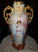 Full view of vase showing shape, handles and painted portrait