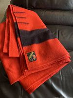 Folded Eaton Trapper wool blanket showing label and color pattern.