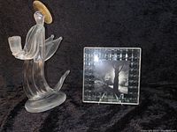Bedford Downing Glass NYC square photo frame holding black and white 5x5 picture and clear glass angel figurine with gold halo, shown on black fabric background.