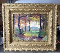 Frontal view of the framed oil painting showing the forest path scene and ornate gilt frame