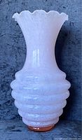Full front view of the large pink Murano glass vase showing shape and color.