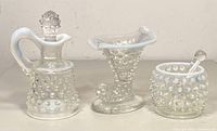 Full view of the three hobnail moonstone glass pieces showing pitcher with stopper, vase, and bowl with spoon.