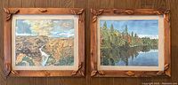 Photo showing two framed watercolour landscape paintings side by side on wooden floor, showcasing frame details and overall size.