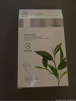 Front of Beautygreen Vitalizing Green Tea Essence Mask box showing product name and branding.