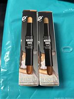 Two boxed Beauty Treats Magic Duo Contour sticks showing the product with dual contour and highlighting shades in stick form.