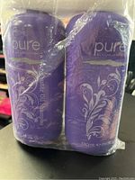 Two large purple bottles labeled 'pure haircare paris', wrapped together in clear plastic. Bottles are shampoo and conditioner, 780 ml each.