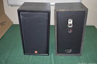 Pair of Cerwin Vega DX-1 speakers including front and back views with both grills attached and one removed showing orange woofer and tweeter.