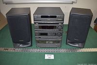Photo shows the full Technics stereo system stack with the SL-CH555 CD player on top and the SA-CH455 component stack below, flanked by two Technics speakers with black cloth covers.
