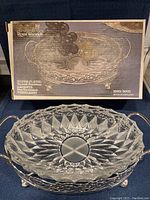Royal Warwick cut glass dish in silver plated holder with original box displayed on table.