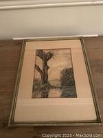 Framed watercolour painting with glass showing full artwork and frame on floor