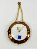 Front view of the vintage Elg-Art wall clock showing the nautical styled rope frame and clock face.