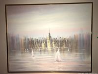 Full view of large textured cityscape canvas wall art with metal frame.